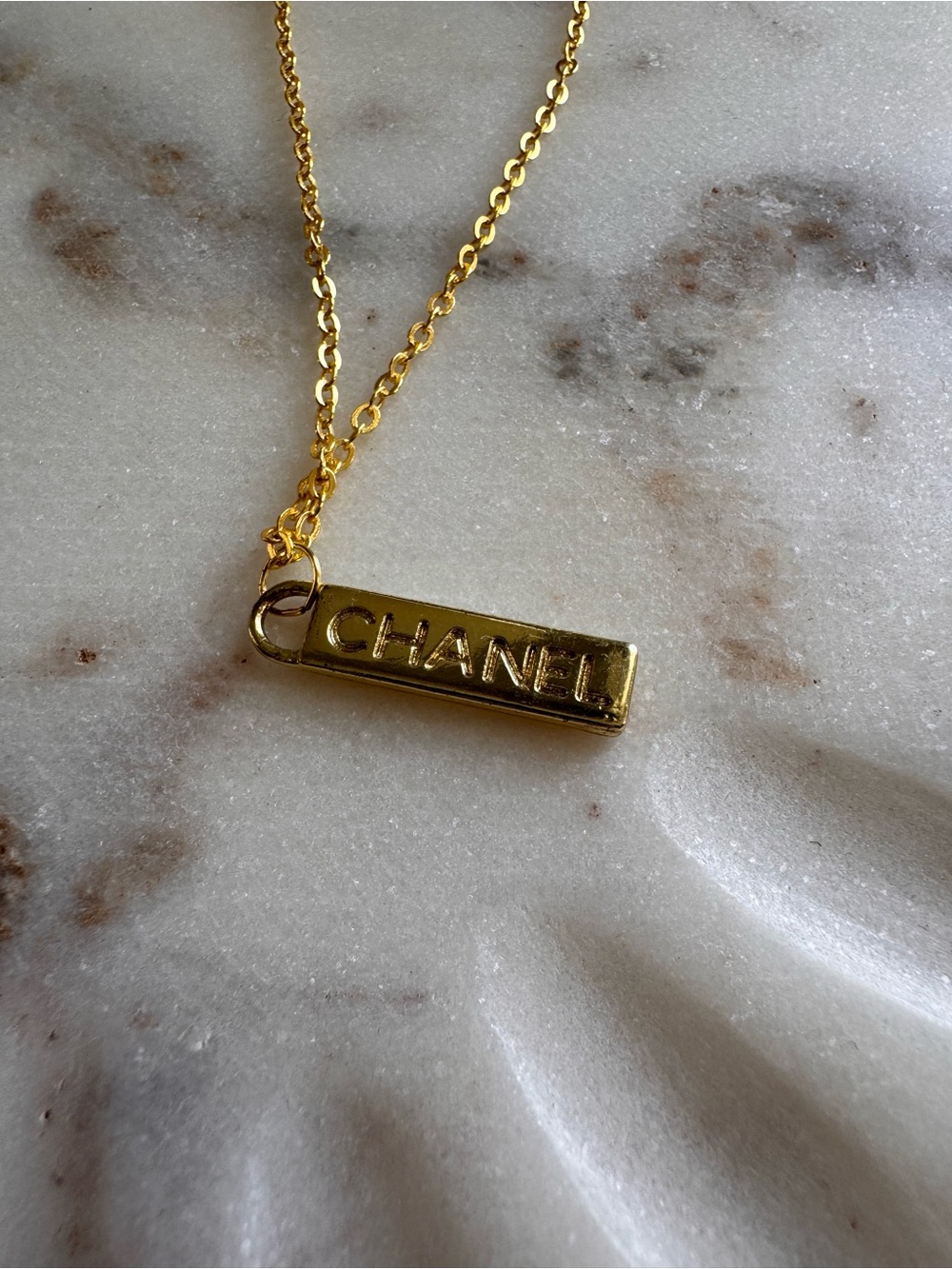 CHANEL Gold Bar Logo Pendant Necklace